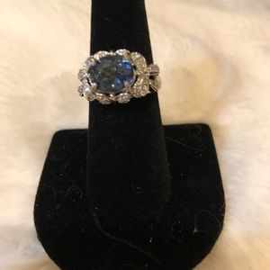 Stunning sterling silver (90+%) with oval blue stone surrounded by diamonds